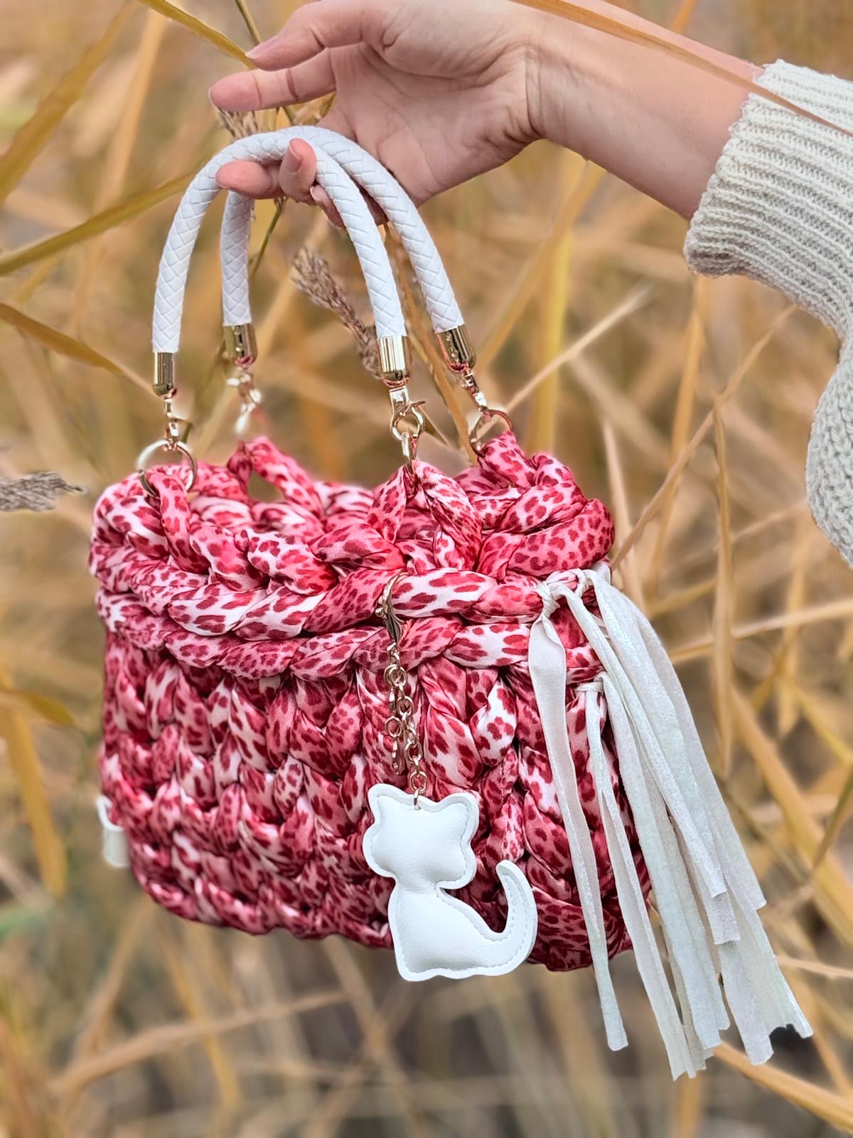 Rose Jungle — pink leopard print chunky knit bag with white rope handles and cat charm