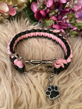 Rose Noir Collar — pink and black paracord dog collar with steel buckle and black paw charm